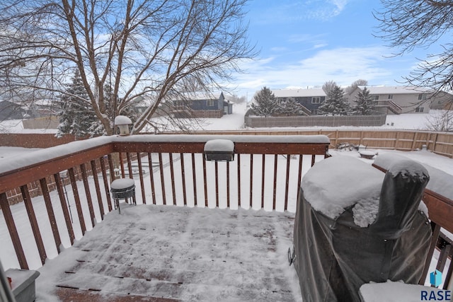 snow covered deck with grilling area