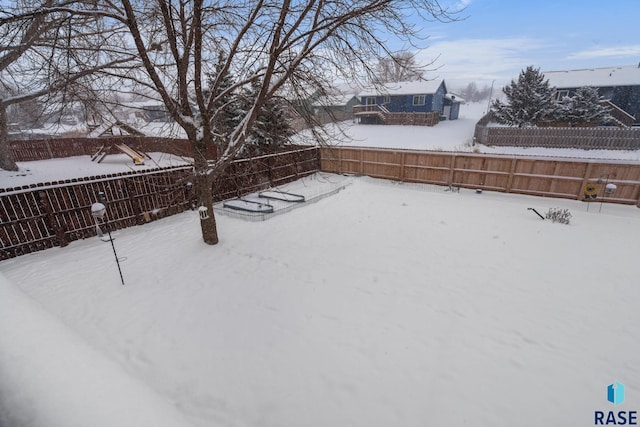 view of yard covered in snow