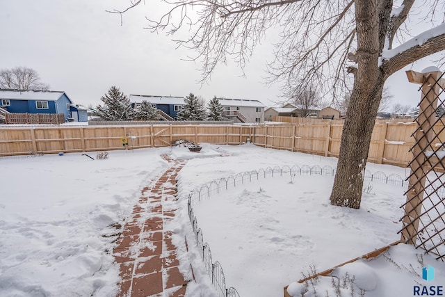 view of yard layered in snow