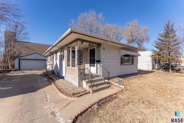 view of front of house with a garage and an outdoor structure