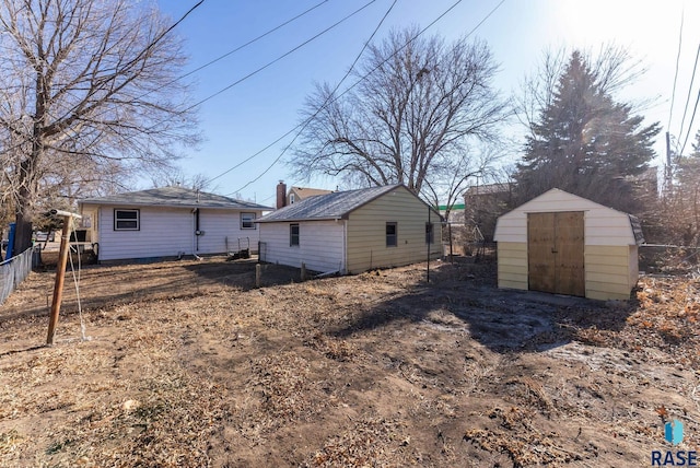 view of side of property with a shed