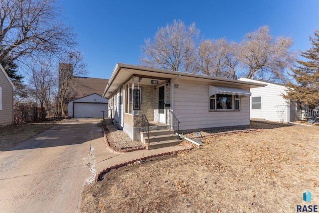 view of front of house with a garage and an outdoor structure