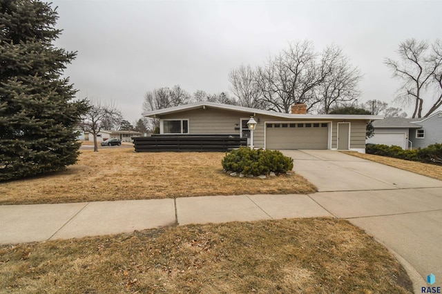 ranch-style home featuring a garage