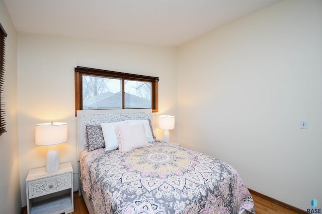 bedroom with hardwood / wood-style floors