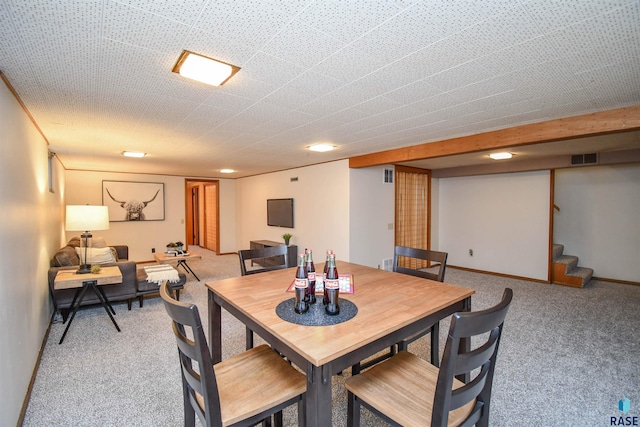 view of carpeted dining area