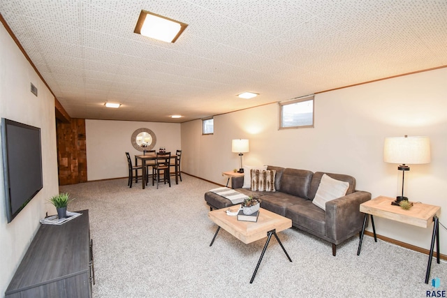 carpeted living room with crown molding