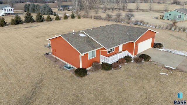 birds eye view of property with a rural view