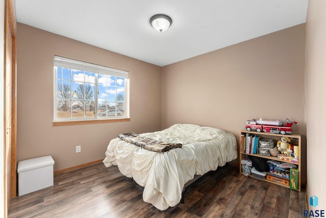 bedroom featuring dark hardwood / wood-style flooring