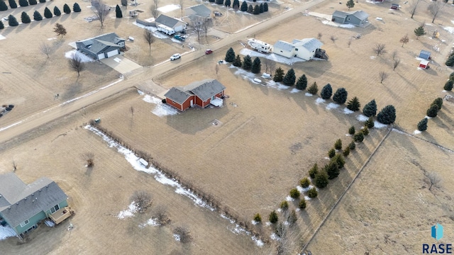 birds eye view of property with a rural view