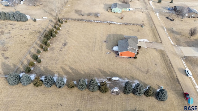 birds eye view of property with a rural view