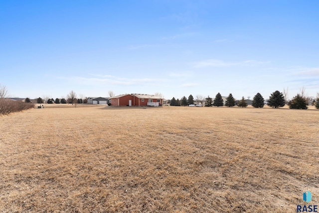 view of yard with a rural view