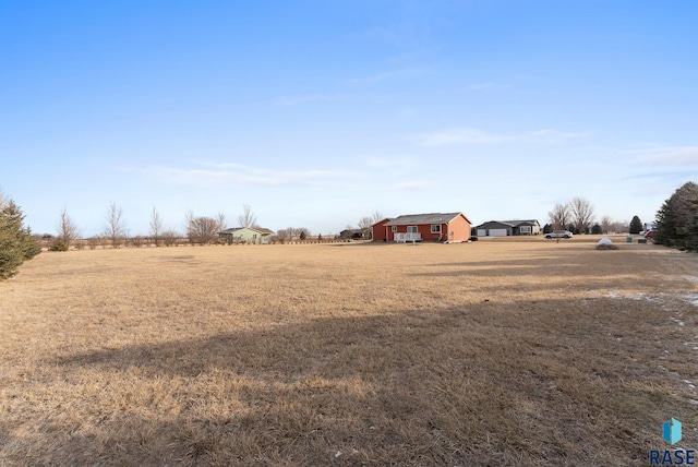 view of yard with a rural view