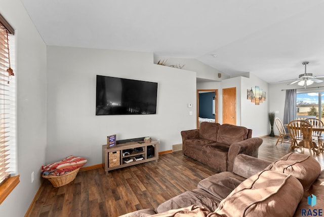 living room featuring lofted ceiling, dark hardwood / wood-style floors, and ceiling fan