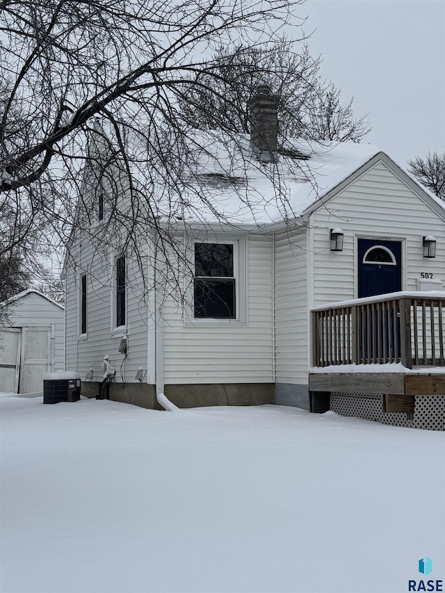 view of front of house with a shed