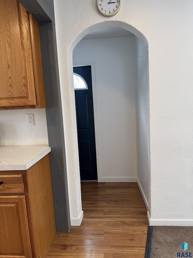 hallway featuring hardwood / wood-style flooring