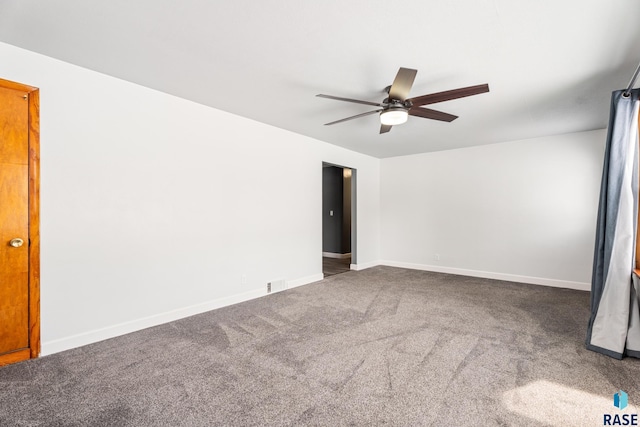 carpeted empty room with ceiling fan