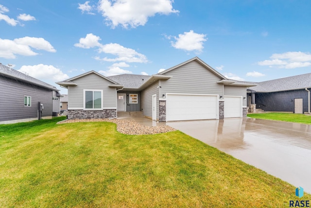 view of front of house featuring a garage and a front lawn