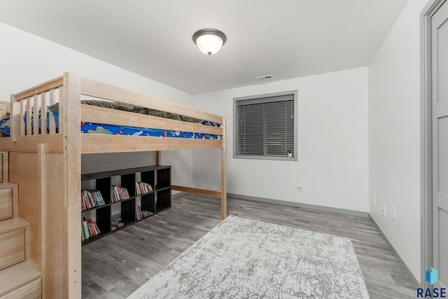 bedroom with hardwood / wood-style flooring