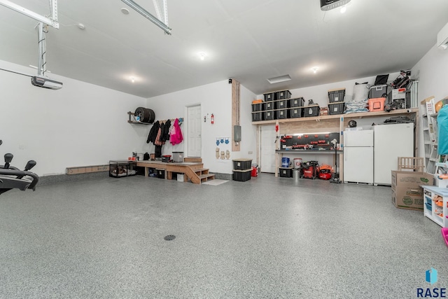 garage with a garage door opener and white refrigerator