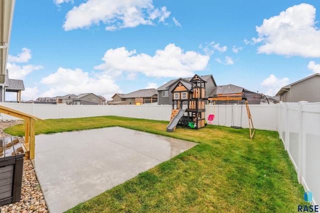 view of yard featuring a patio and a playground