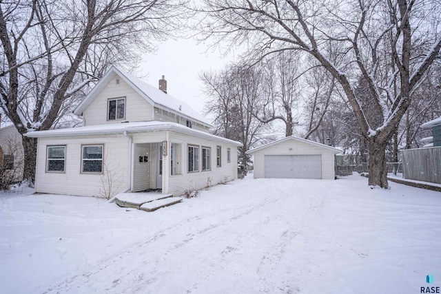 view of front of property featuring an outbuilding and a garage