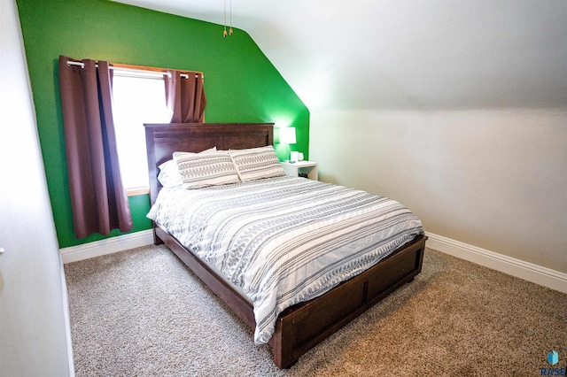 bedroom with vaulted ceiling and carpet