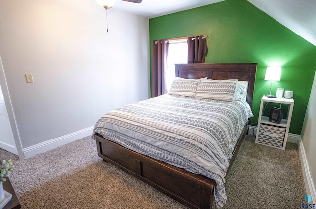 bedroom with ceiling fan, carpet floors, and vaulted ceiling