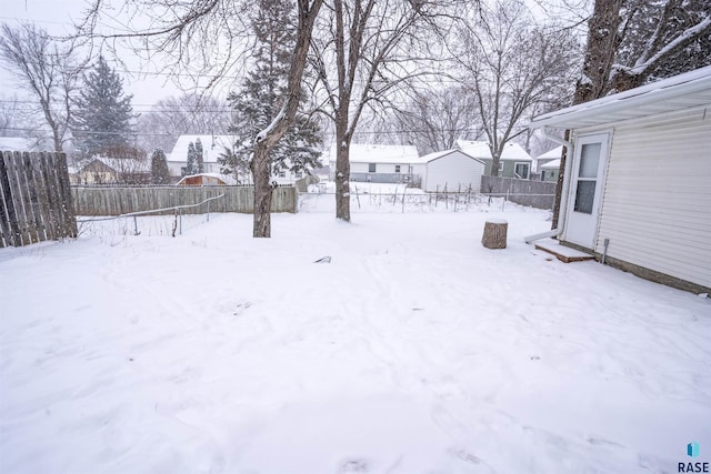 view of yard covered in snow