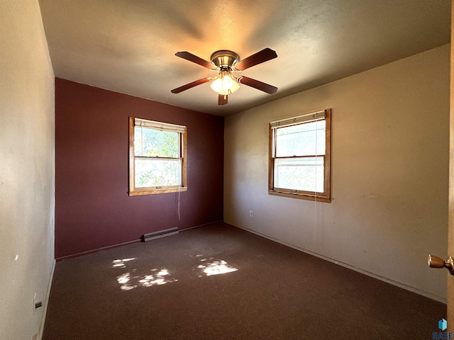 unfurnished room featuring dark carpet and ceiling fan