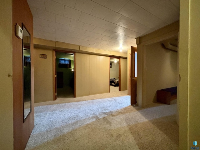 basement with light colored carpet