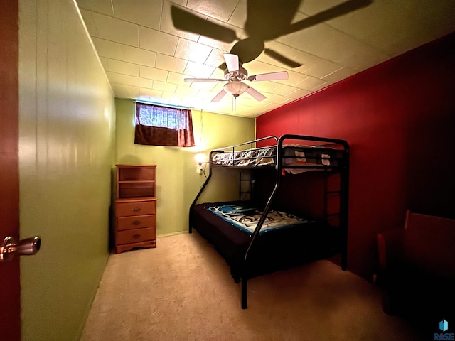 bedroom featuring ceiling fan and light carpet