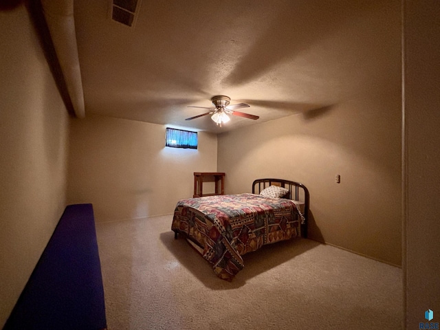 bedroom with ceiling fan and carpet floors