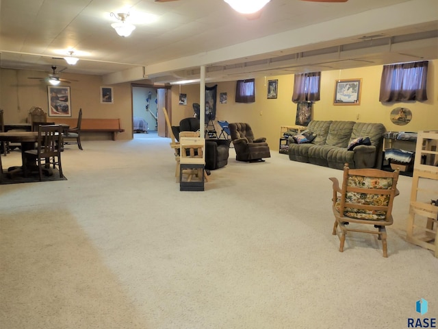 living room with ceiling fan and carpet flooring