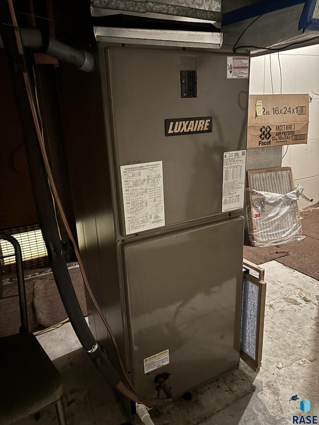 utility room with heating unit