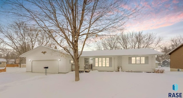 single story home featuring a garage