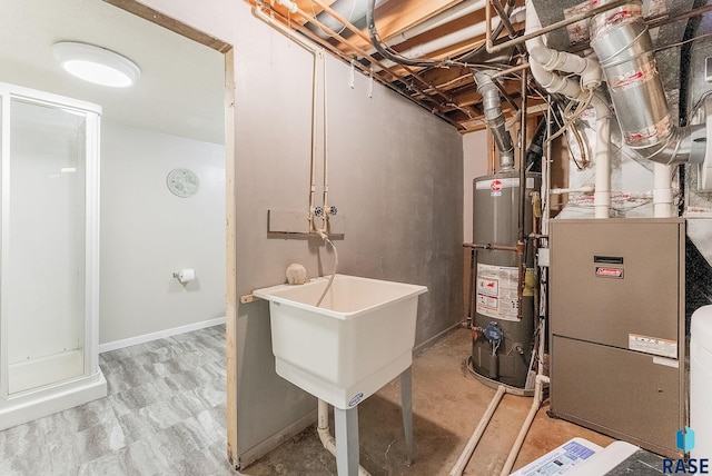 utility room with gas water heater, sink, and heating unit