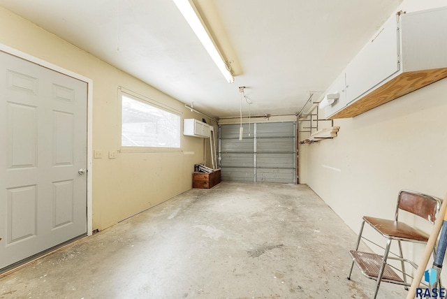 garage featuring a wall unit AC