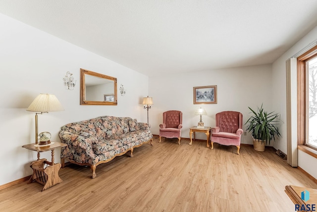 living area with light hardwood / wood-style flooring