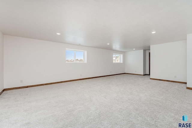 empty room with light colored carpet