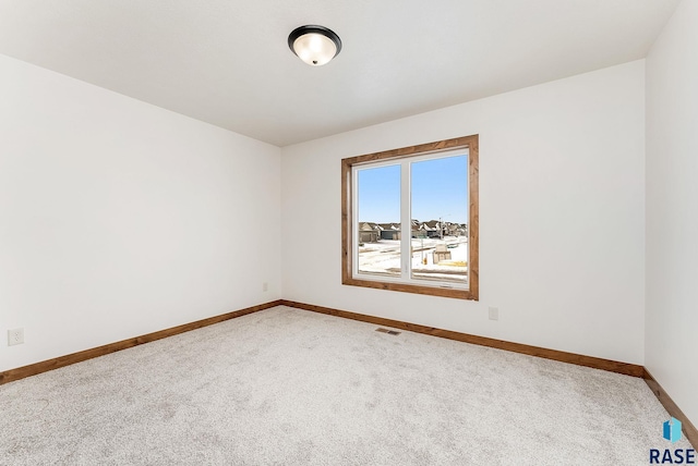 unfurnished room with carpet flooring