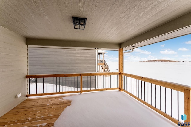 view of snow covered deck