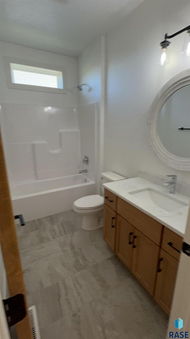 full bathroom featuring vanity,  shower combination, and toilet