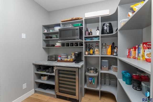 pantry featuring wine cooler