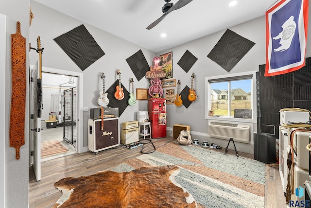 rec room featuring ceiling fan, lofted ceiling, and wood-type flooring