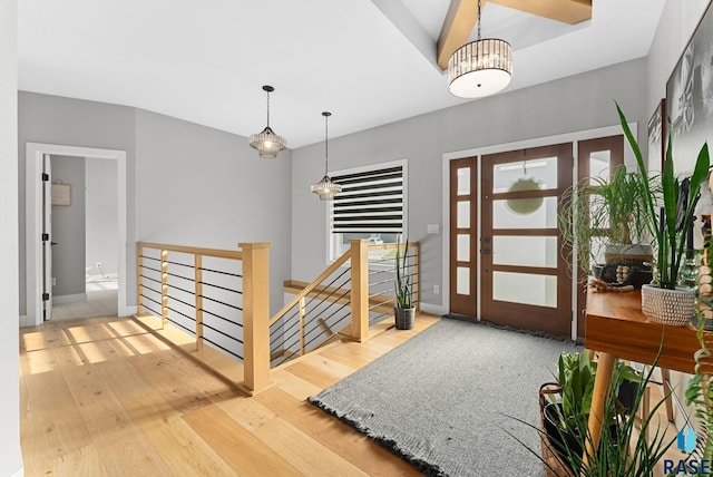 entryway with hardwood / wood-style flooring