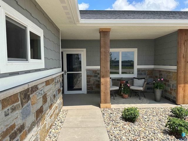 doorway to property with a patio