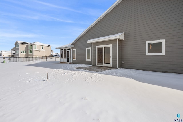 view of snow covered house