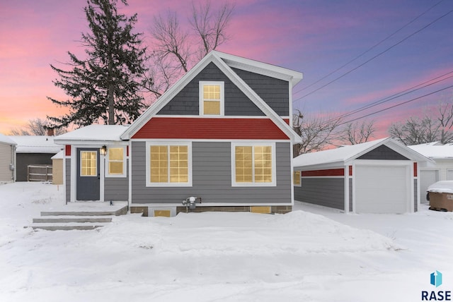 view of front facade featuring an outbuilding and a garage