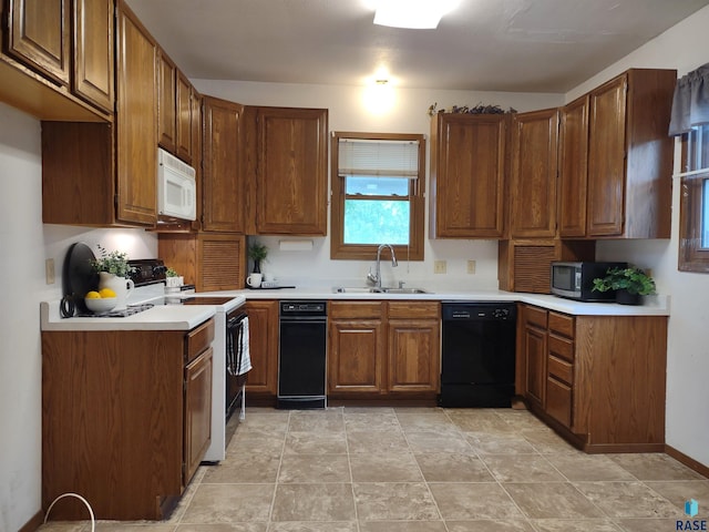 kitchen featuring electric stove, sink, and dishwasher