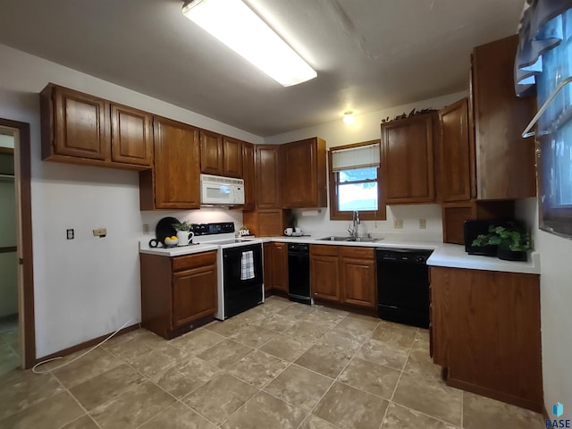 kitchen featuring sink, range with electric stovetop, and dishwasher